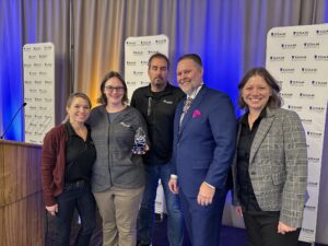 Awardees from Saint Paul Port Authority and Ever-Green on stage